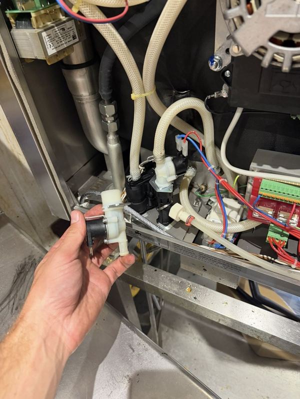 Faulty fill solenoid valve removed from a commercial dishwasher