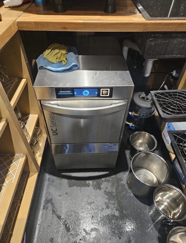 Winterhalter undercounter glasswasher in a commercial bar